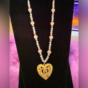 Elegant Gold Heart Pendant Necklace on pale pink stone strand, 22”